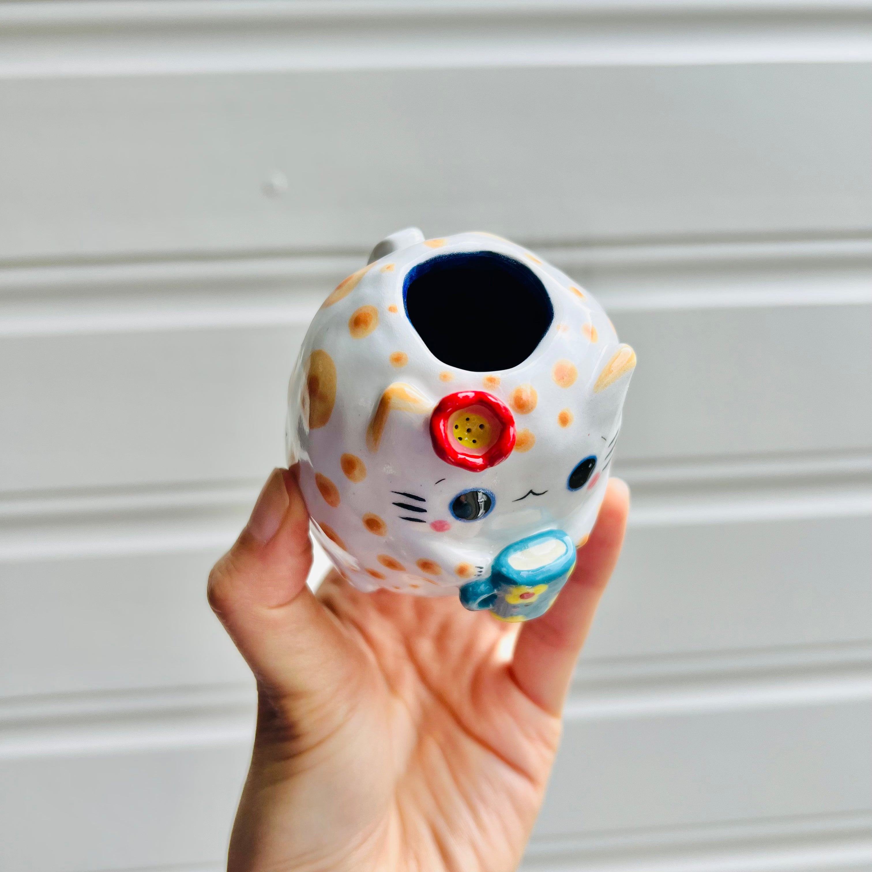 Ginger cat vase with blue mug friend