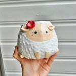 Flowery sheep pot