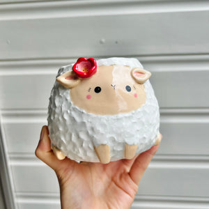 Flowery sheep pot