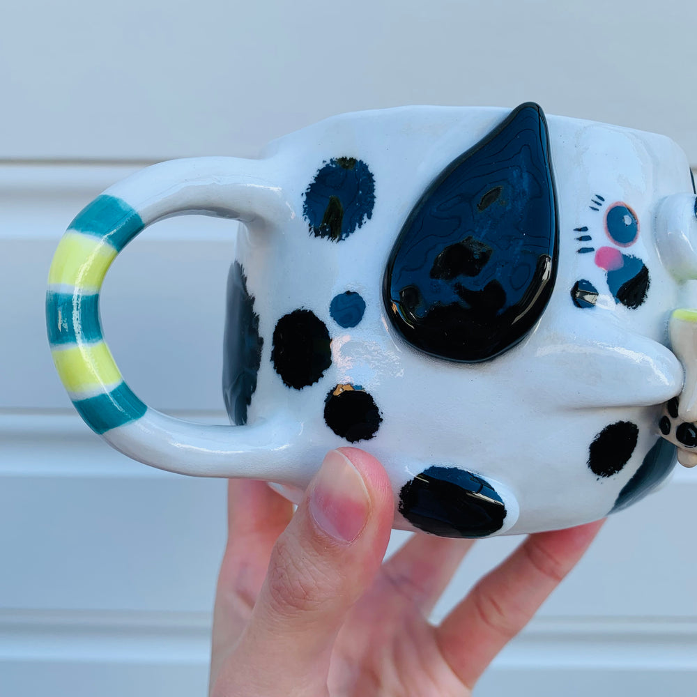 Black and white spotty doggo with bubble tea mug, photo 6 of 10
