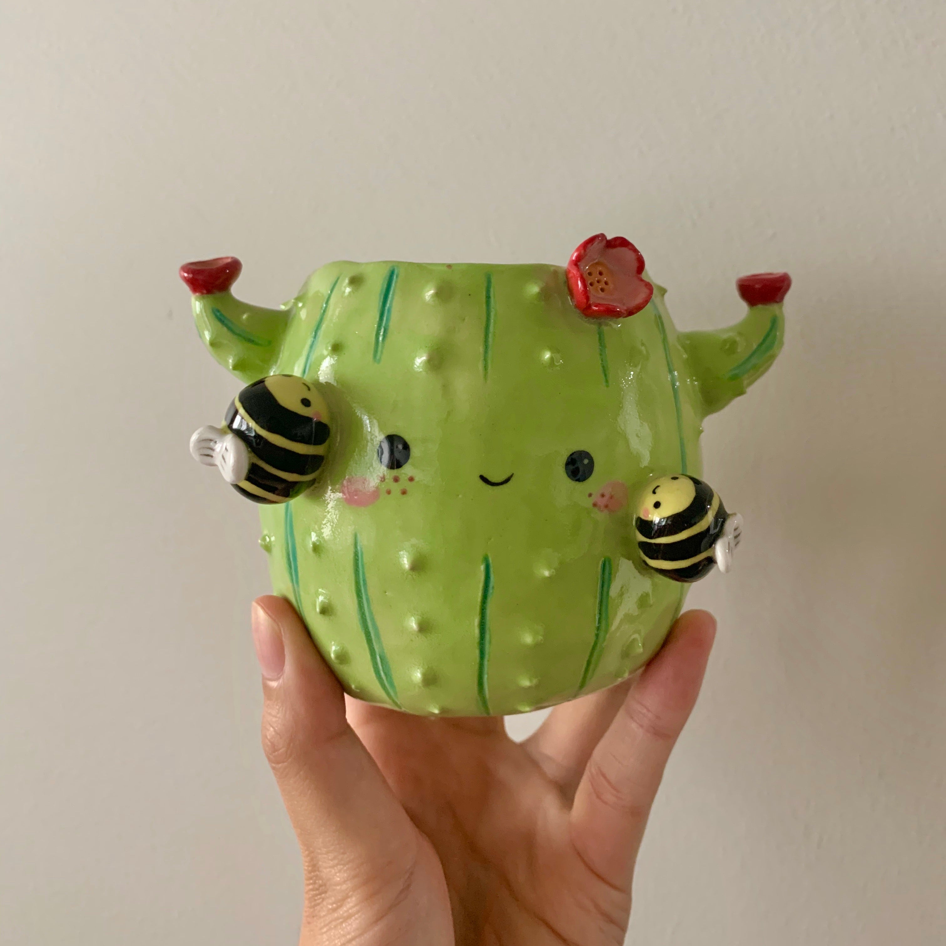 Flowery cactus pot with busy bee friends