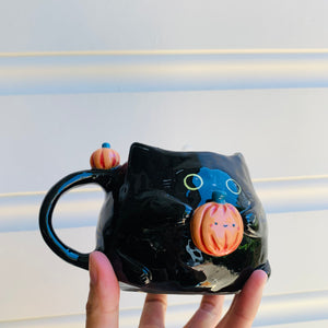 Black cat mug with pumpkin friends