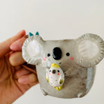 Koala with cockatoo friend mug