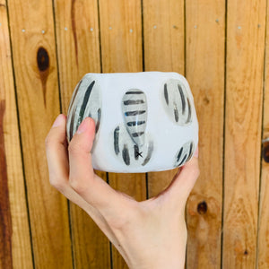 Stripey grey cat pot with bee friend