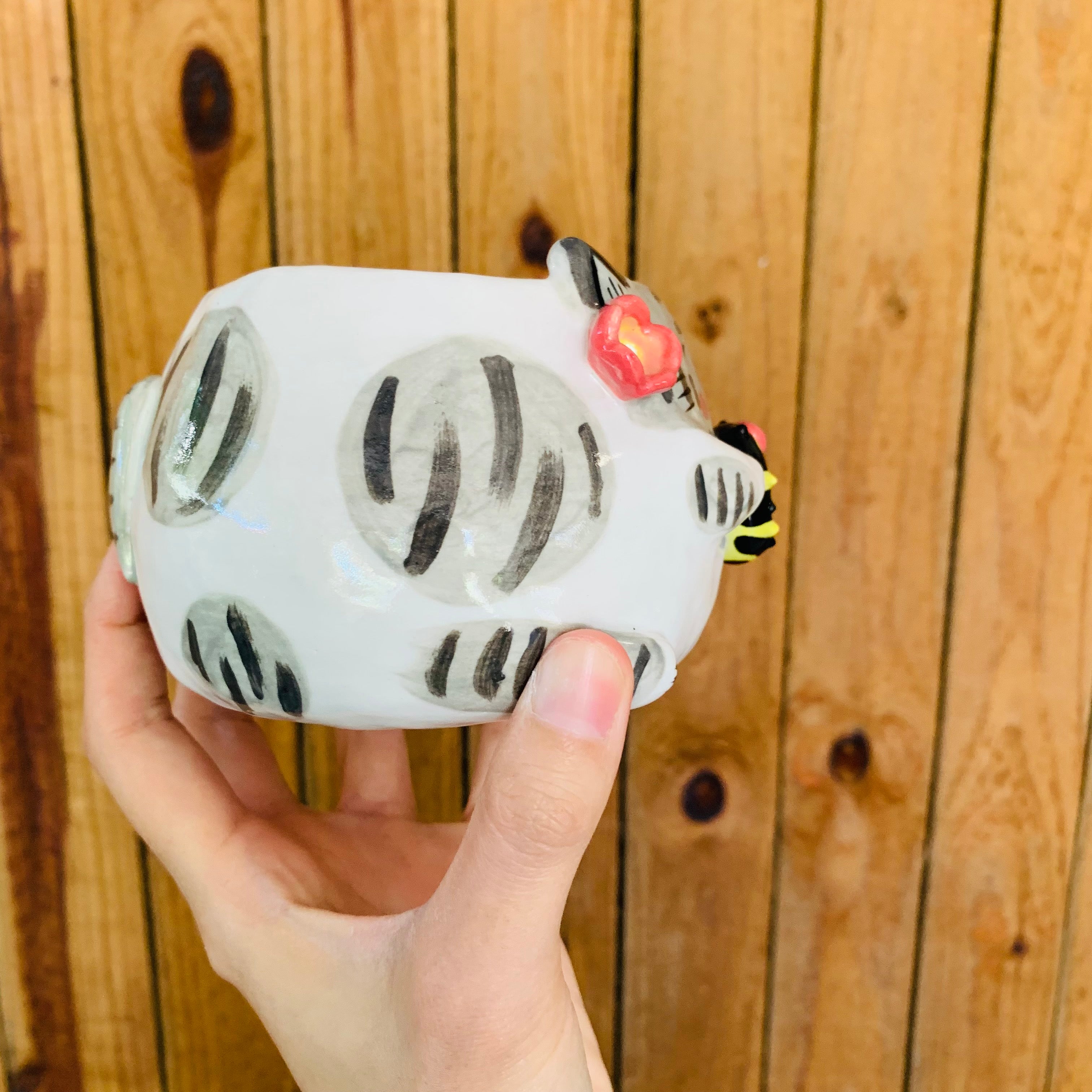 Stripey grey cat pot with bee friend