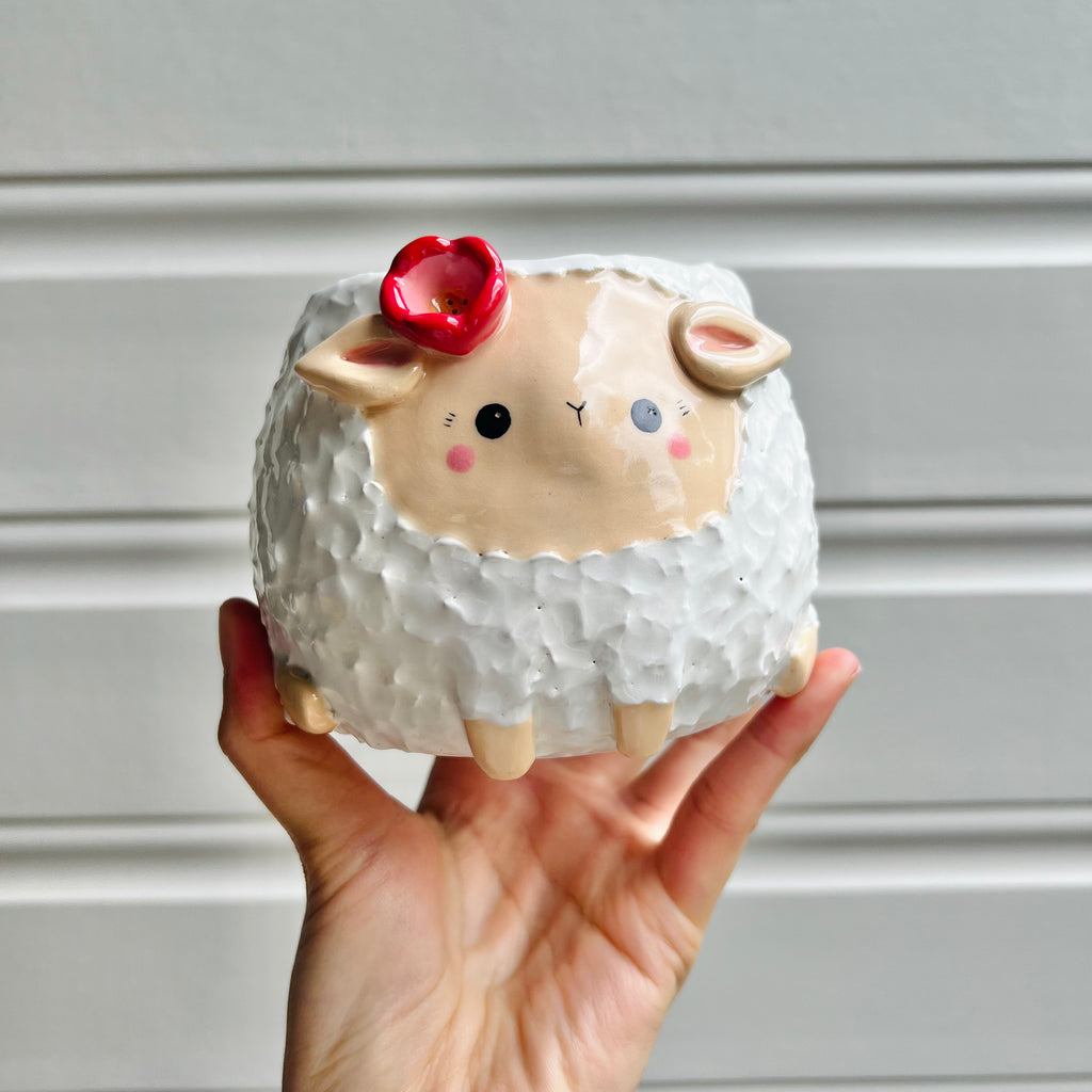 Flowery sheep pot