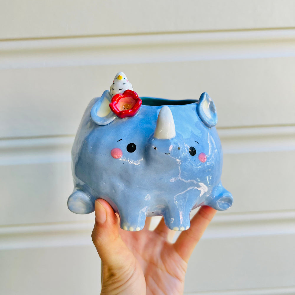 Rhino pot with egret friend, photo 1 of 5