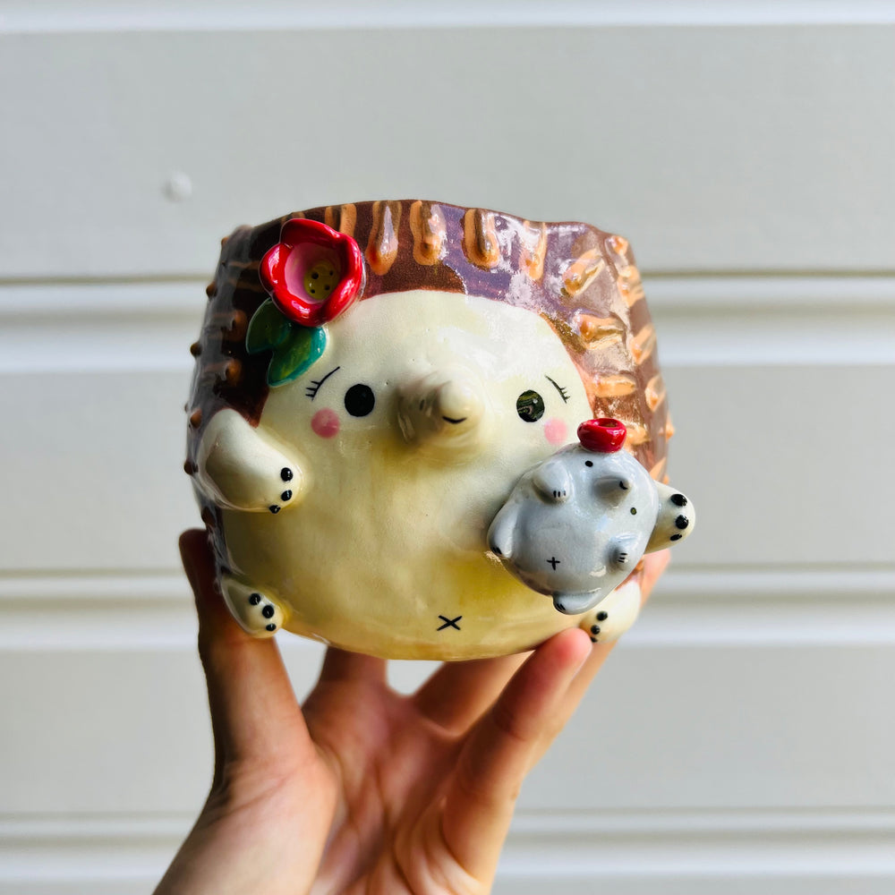 Flowery Echidna pot with Puggle baby, photo 1 of 5