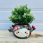 Happy flowery tree with bees, cat and pink galah planter