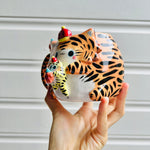 Hat wearing tiger with mandarin friend mug with baby tiger