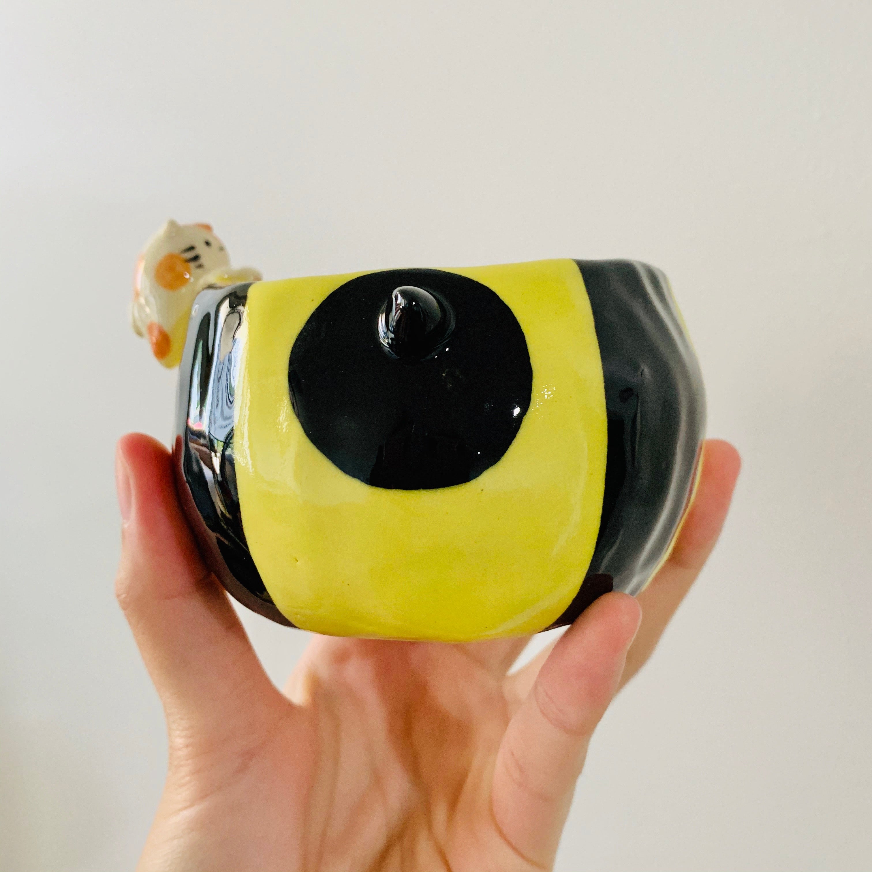 Flowery bee snack bowl with cat friend