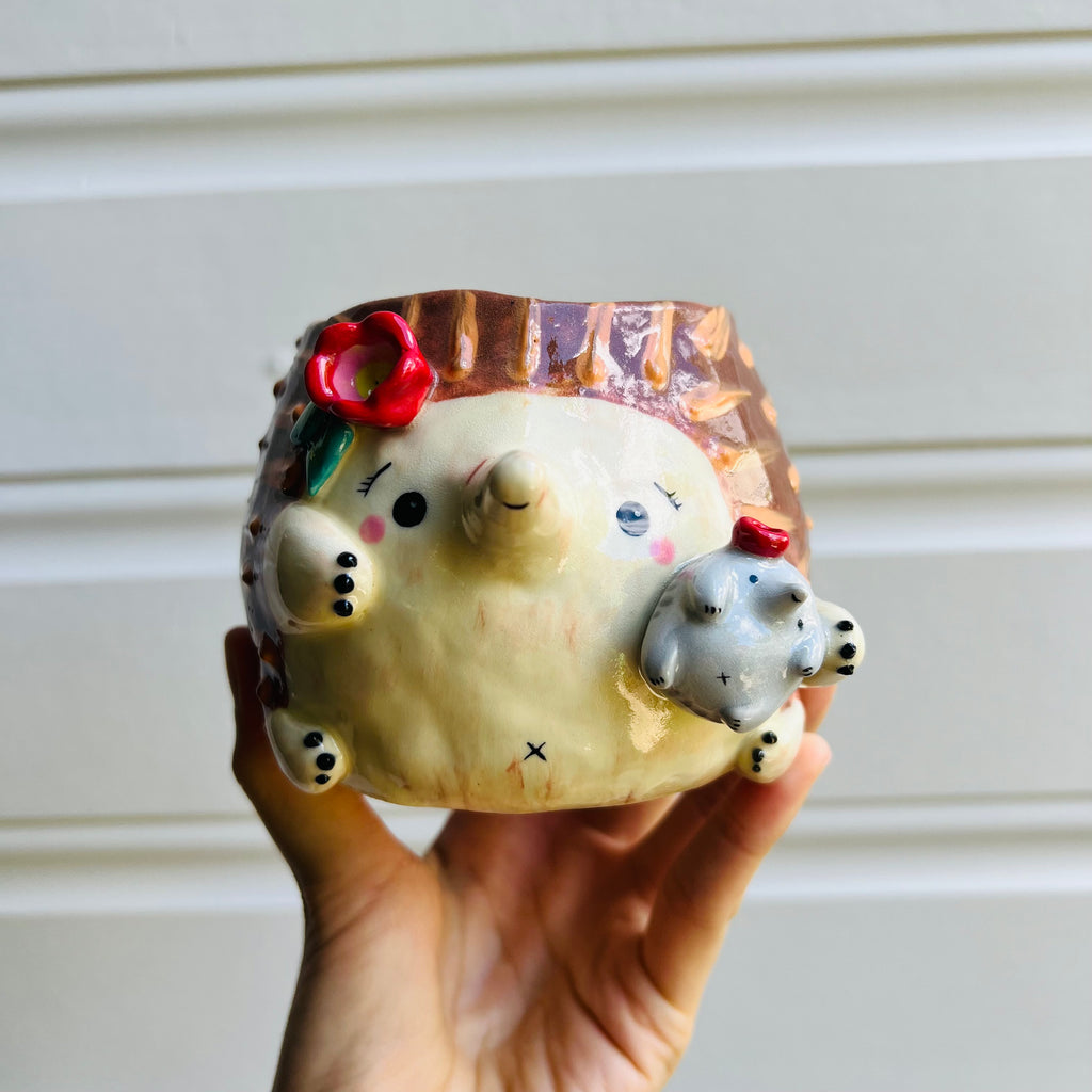 Flowery Echidna pot with puggle baby