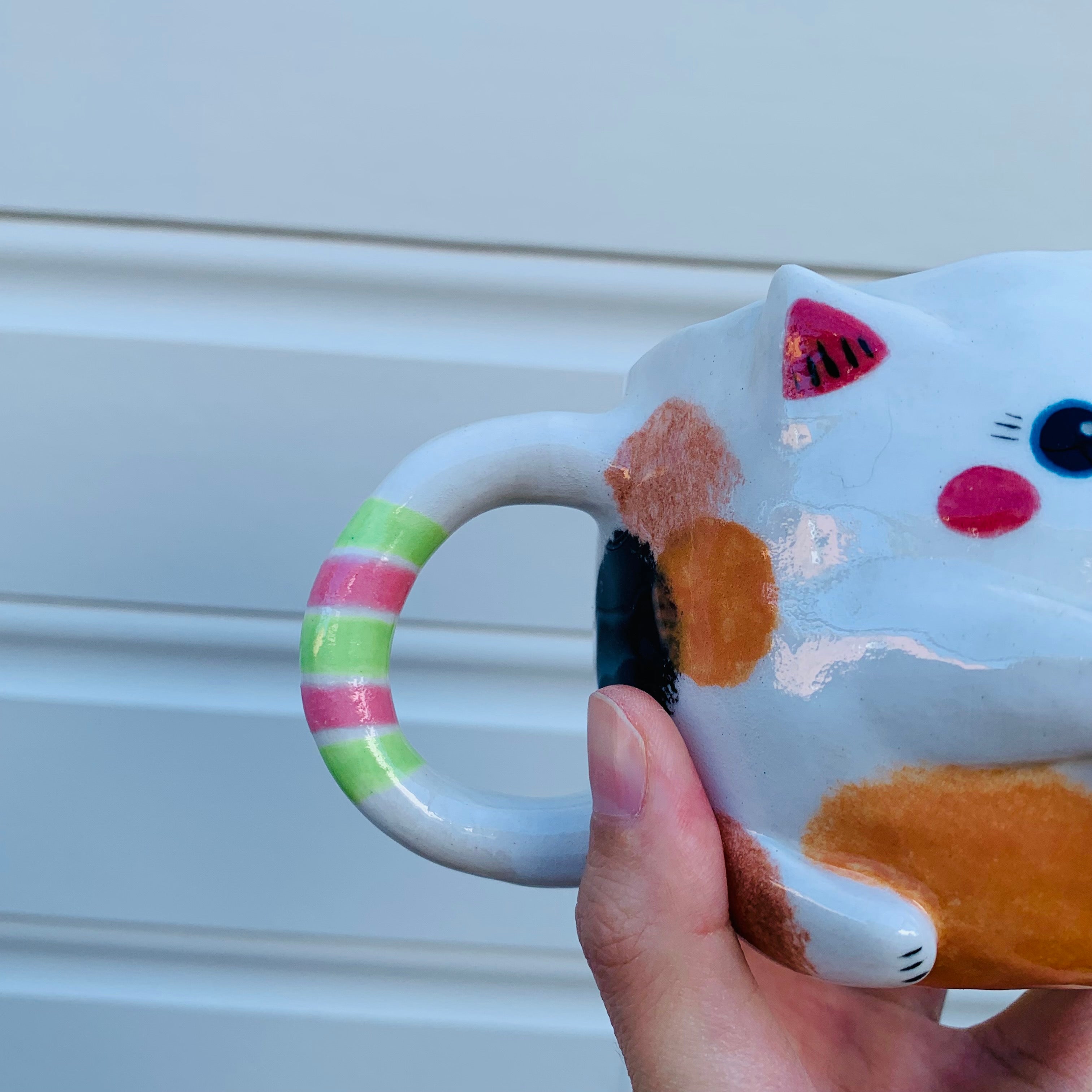 Spotty cat with bubble tea mug