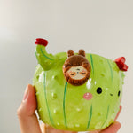 Flowery cactus pot with sloth friend