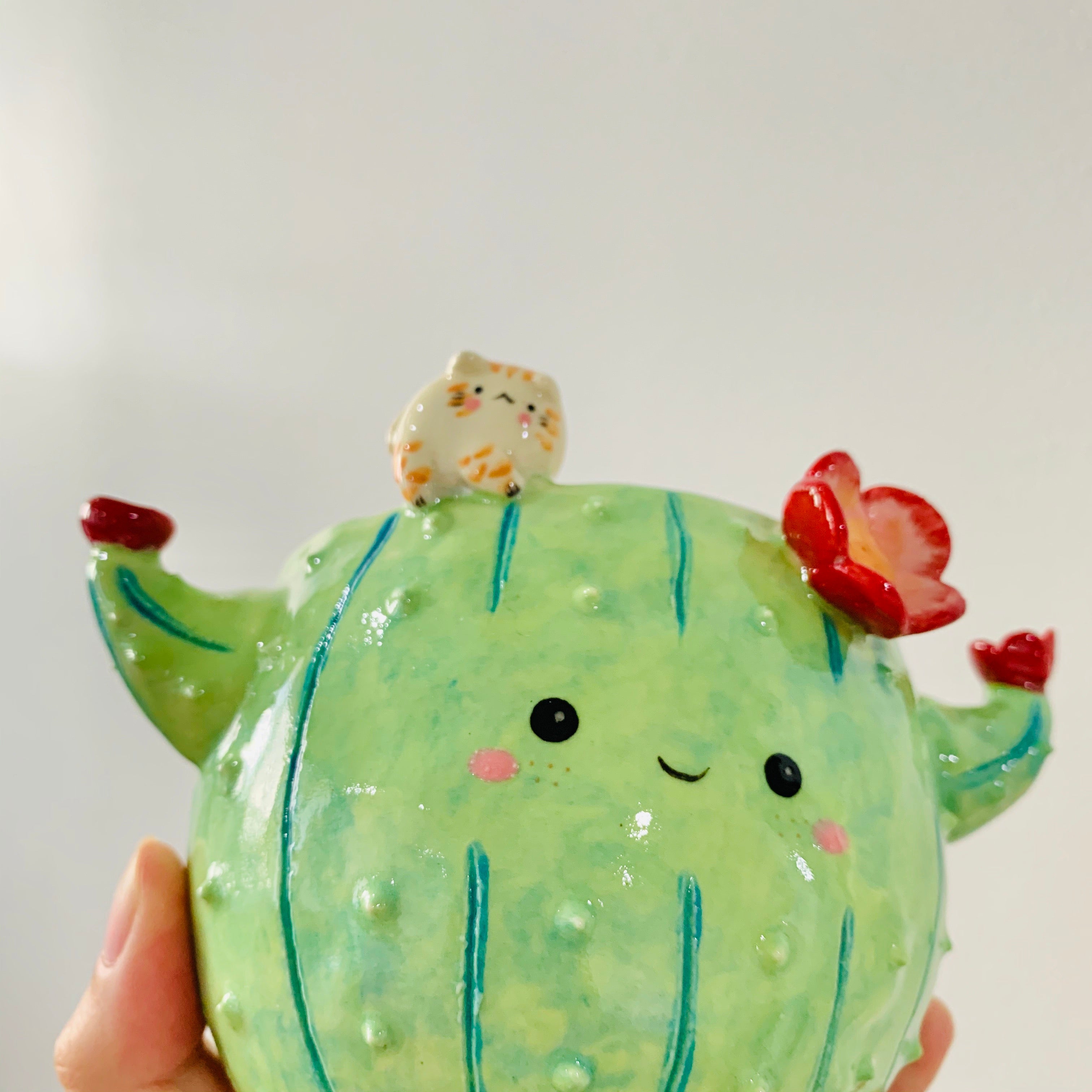 Flowery cactus pot with cat friend