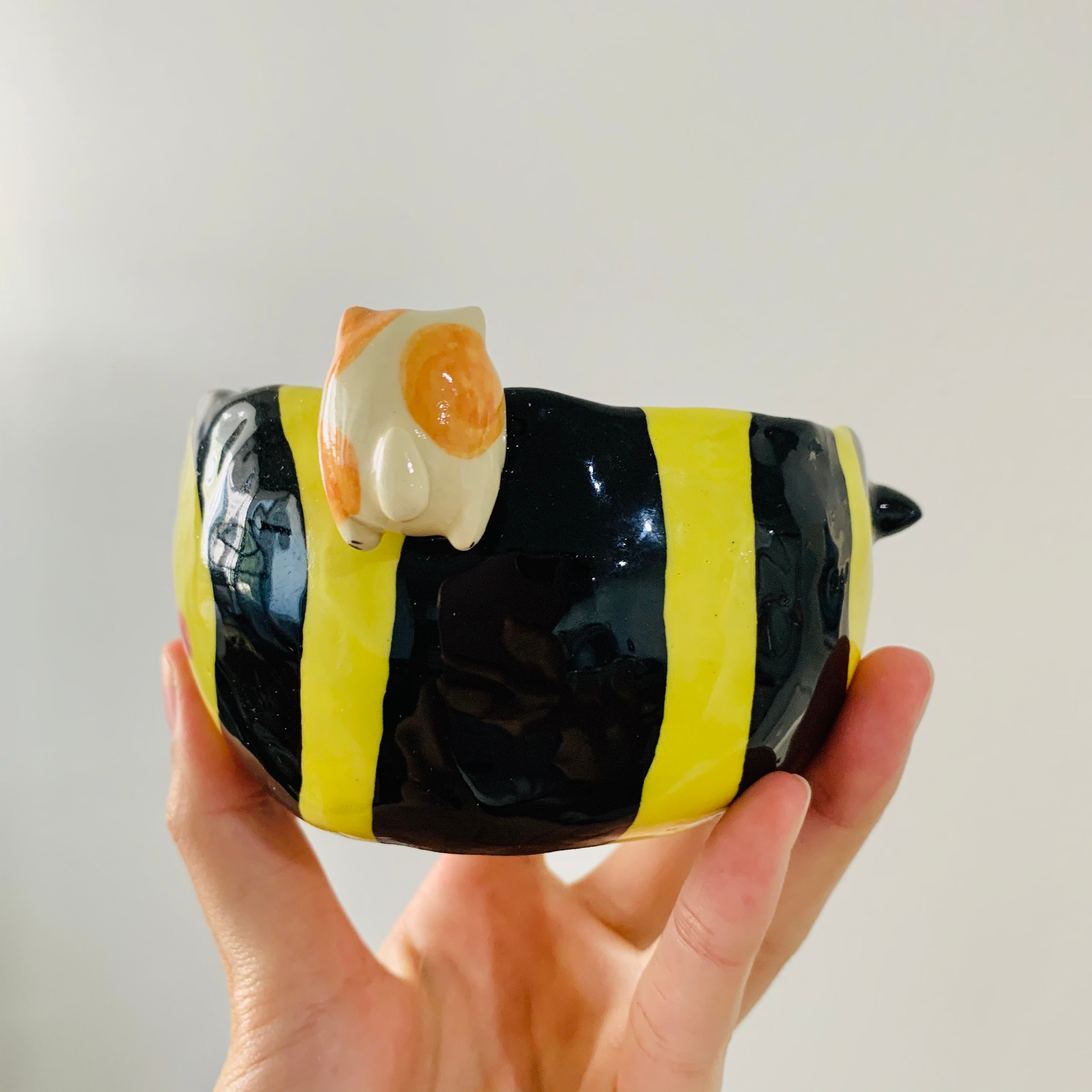 Flowery bee snack bowl with cat friend