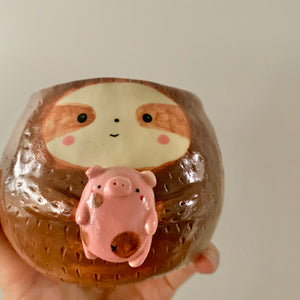 Friendly sloth pot with pig friend