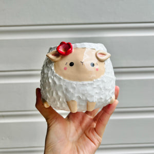 Flowery sheep pot