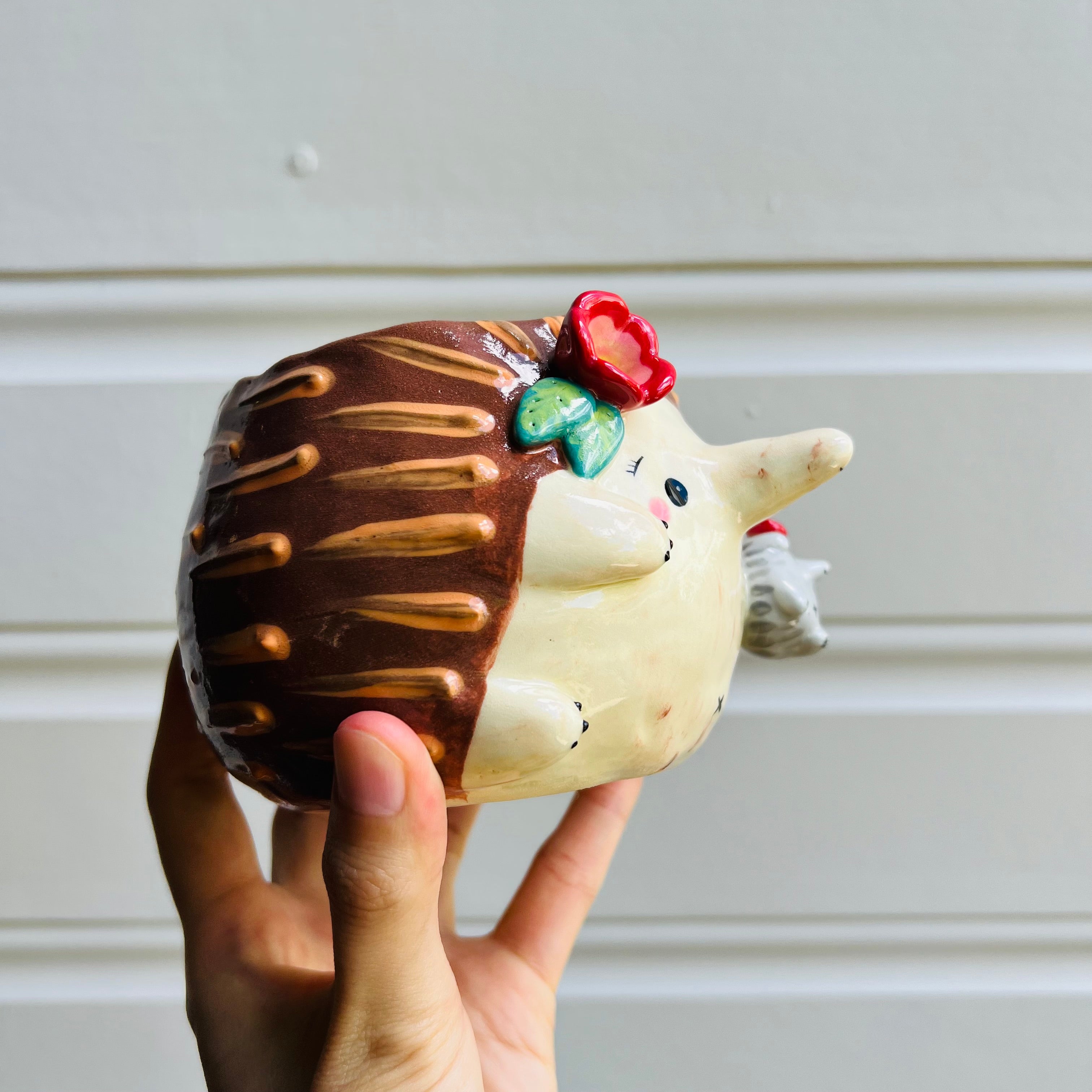 Flowery Echidna pot with Puggle baby