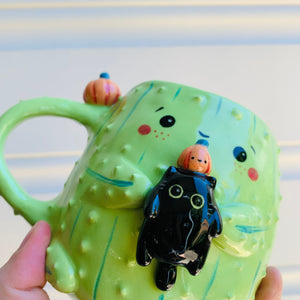 Pumpkin cactus mug with black cat friend