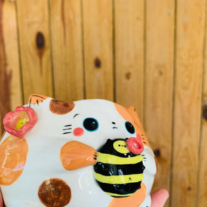 Spotty cat pot with bee friend