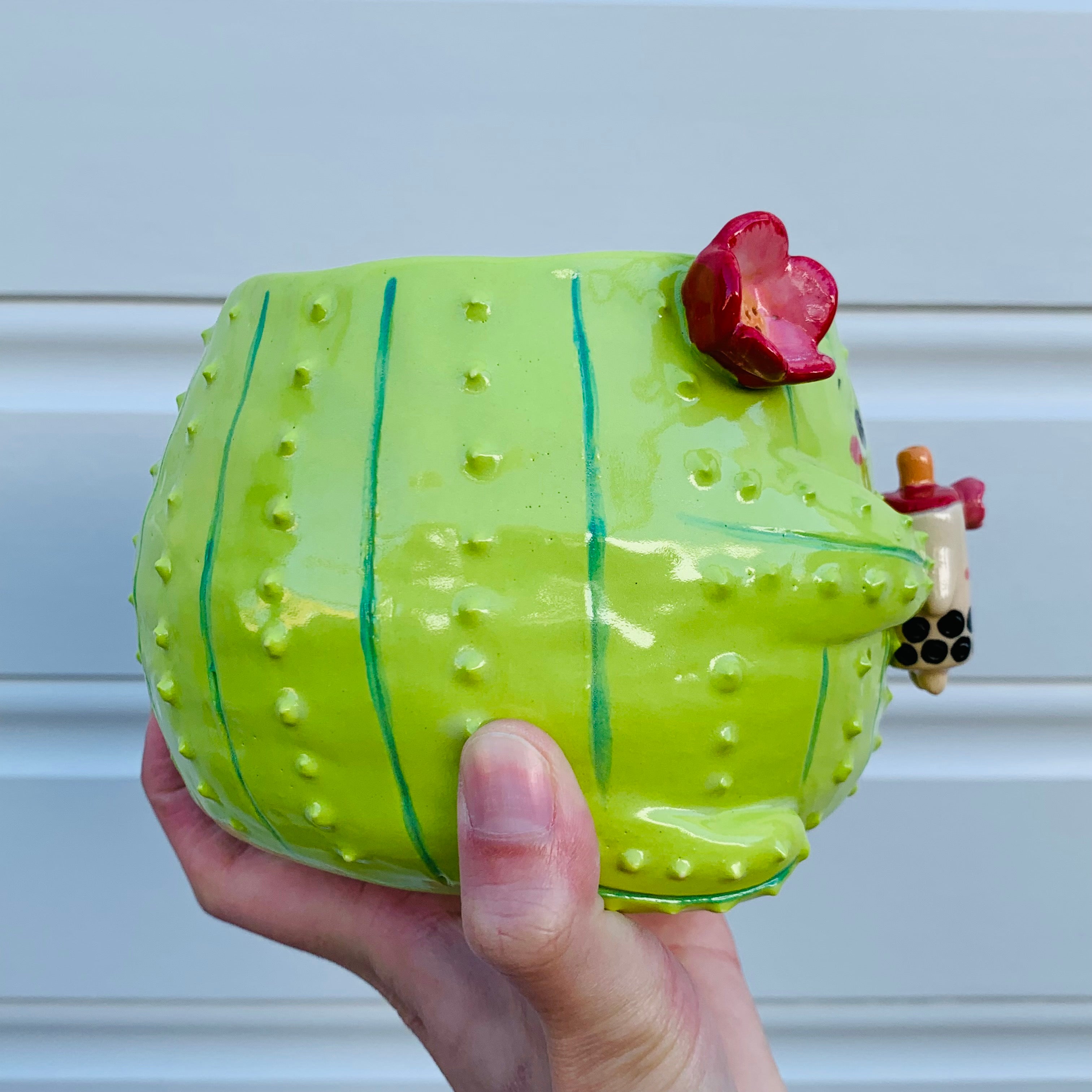 Light green flowery cactus with bubble tea planter