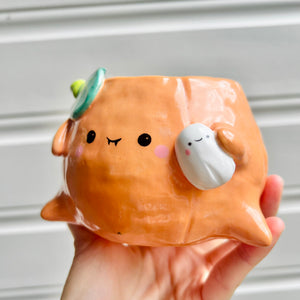 Halloween pumpkin pot with ghost friend