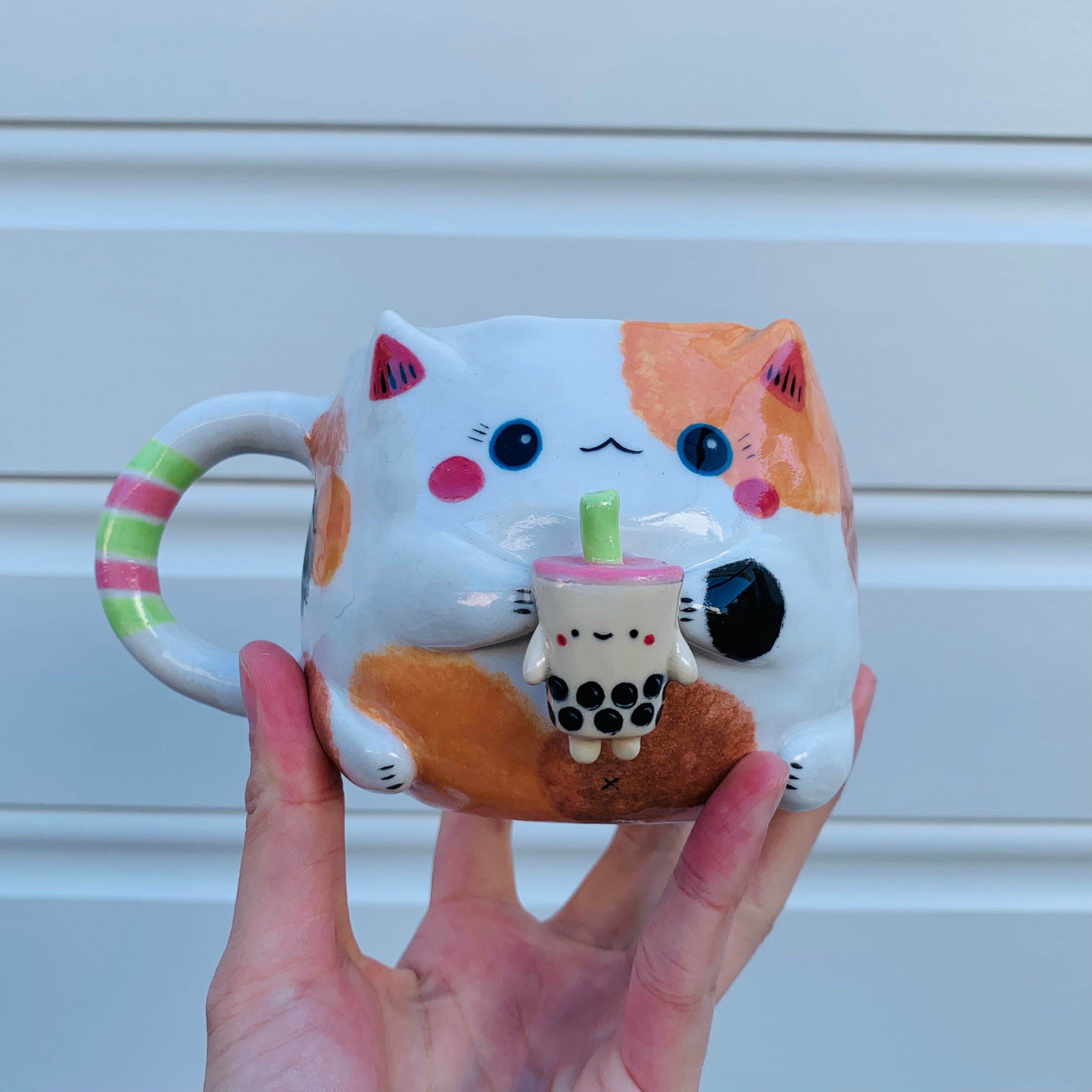 Spotty cat with bubble tea mug