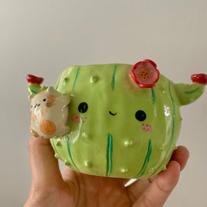 Flowery cactus pot with cat friend