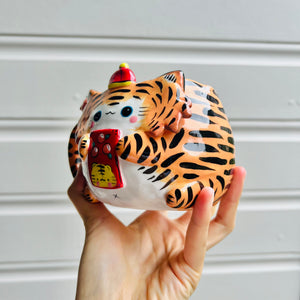 Hat wearing tiger and mandarin friend mug with red packet