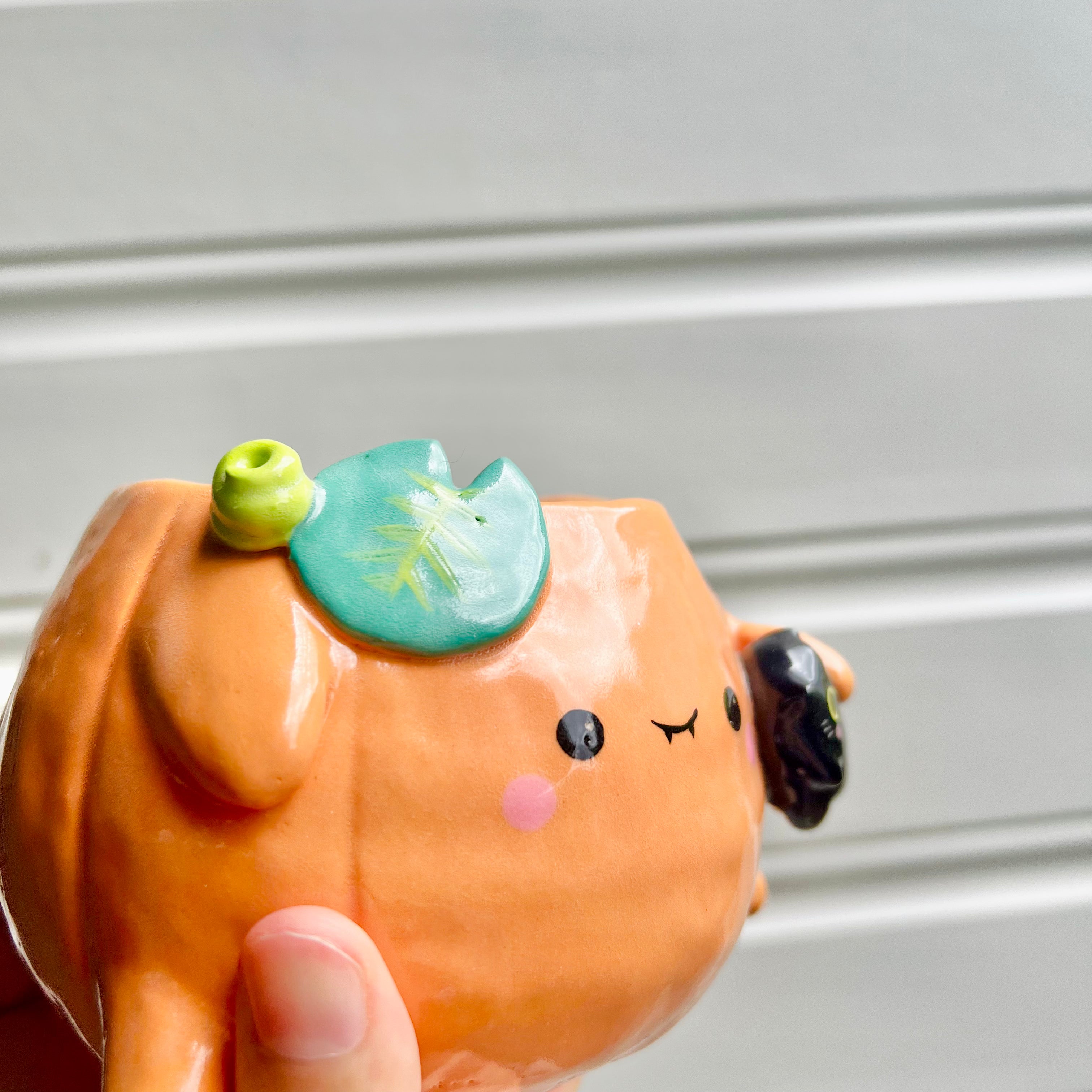 Halloween pumpkin pot with black cat friend