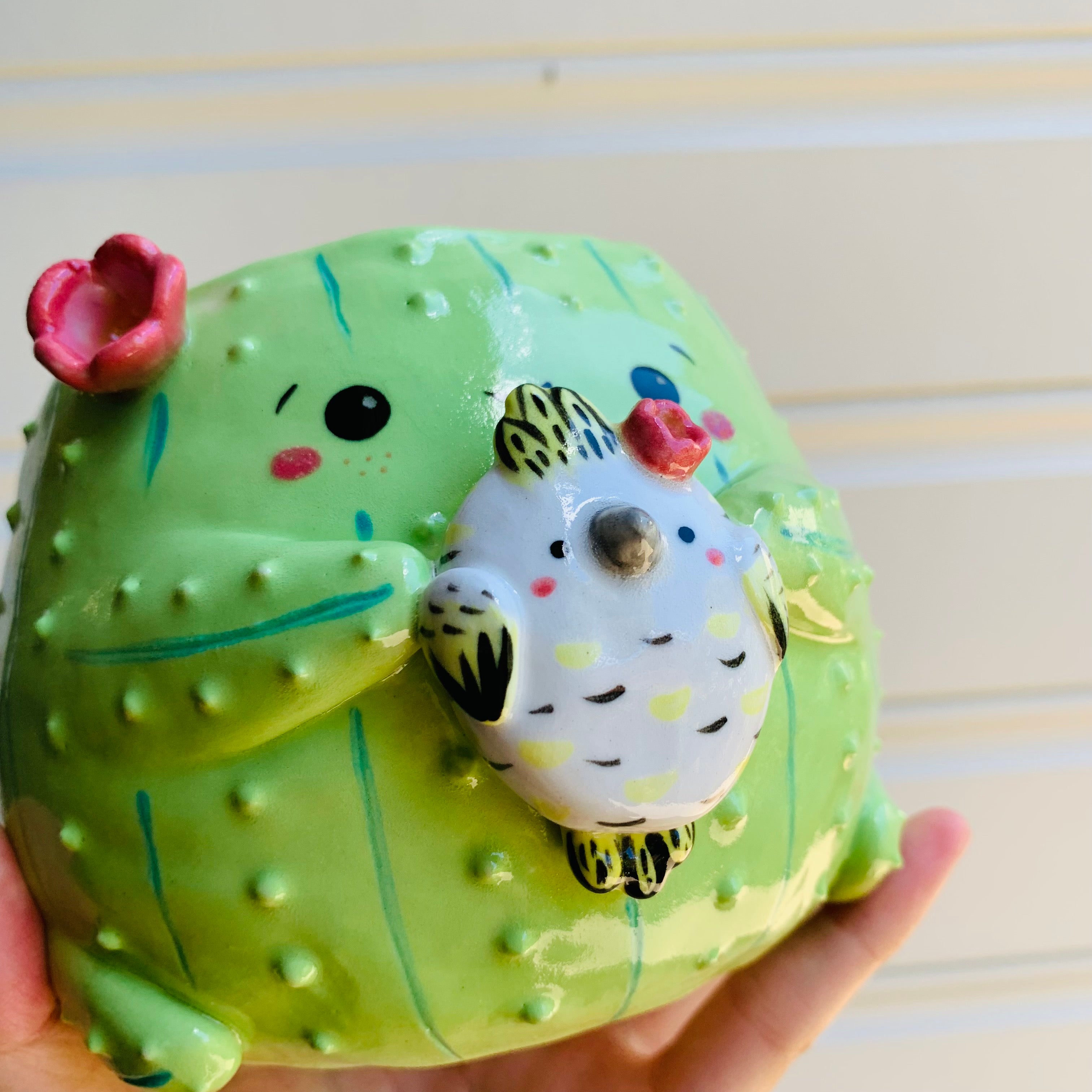 Flowery cactus pot with cockatoo friend