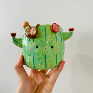 Flowery cactus pot with sloth friends