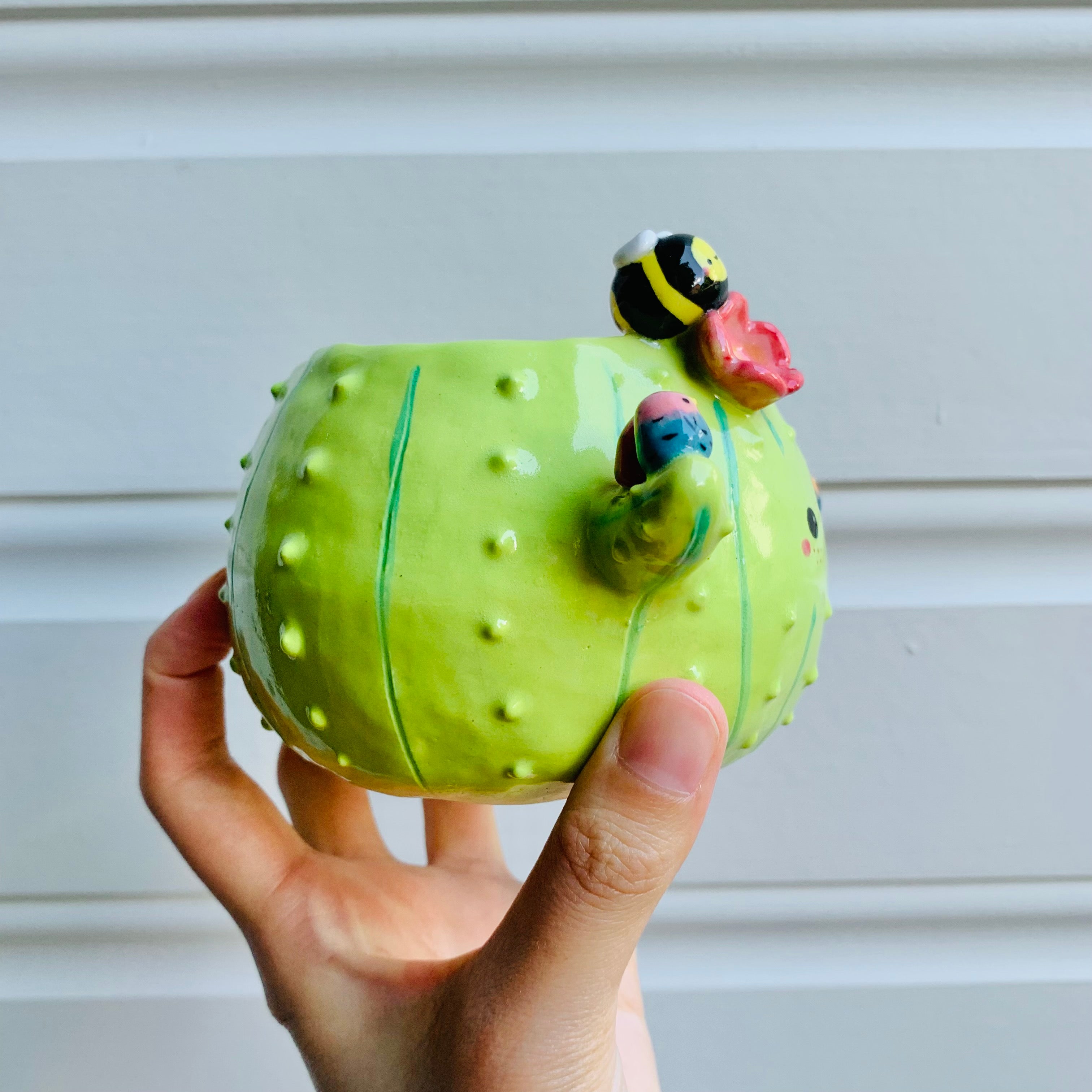 Flowery cactus pot with bird and bee friends