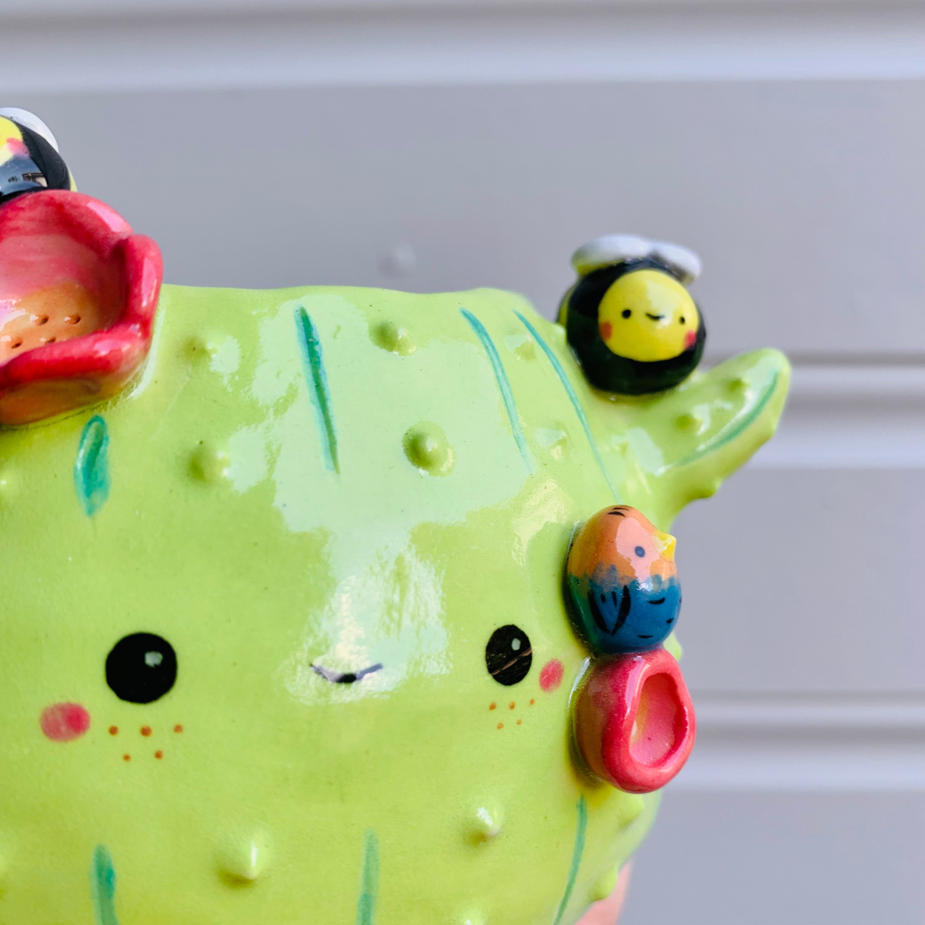 Flowery cactus pot with bird and bee friends