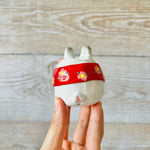 LNY cape wearing bunny vase with Daruma friend