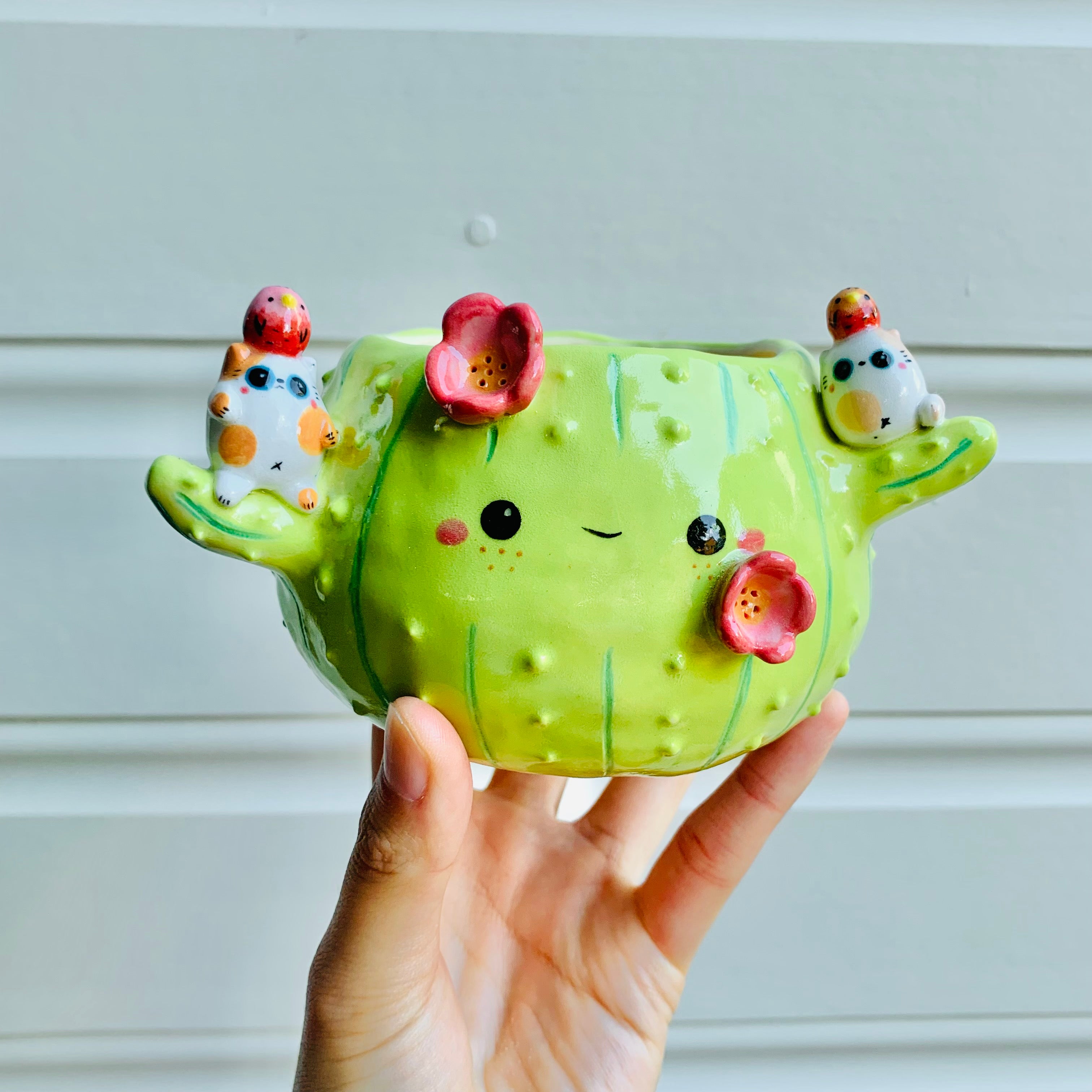 Flowery cactus pot with cat and bird friends