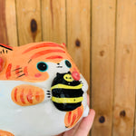 Ginger stripey cat pot with bee friend