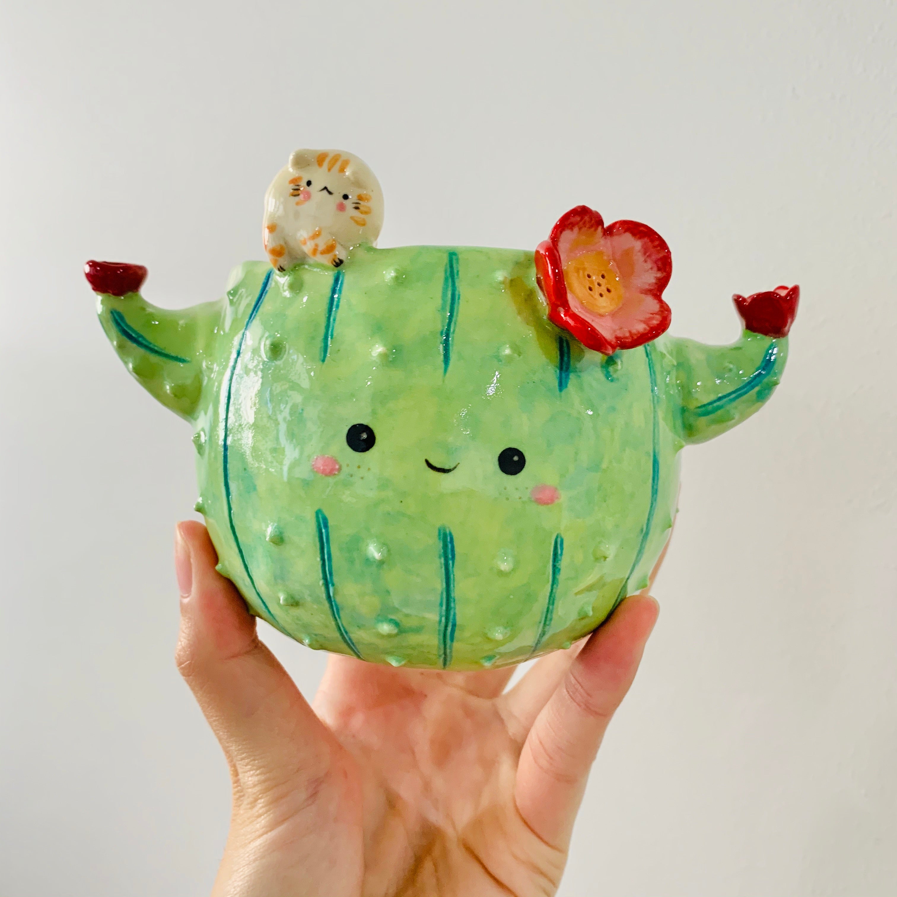 Flowery cactus pot with cat friend