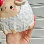 Flowery sheep pot