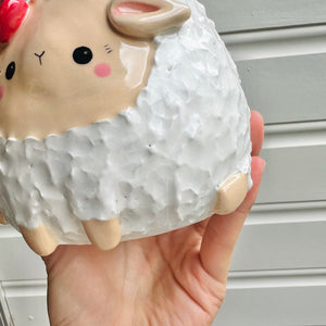 Flowery sheep pot