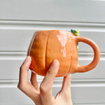 Halloween pumpkin mug with black cat friend