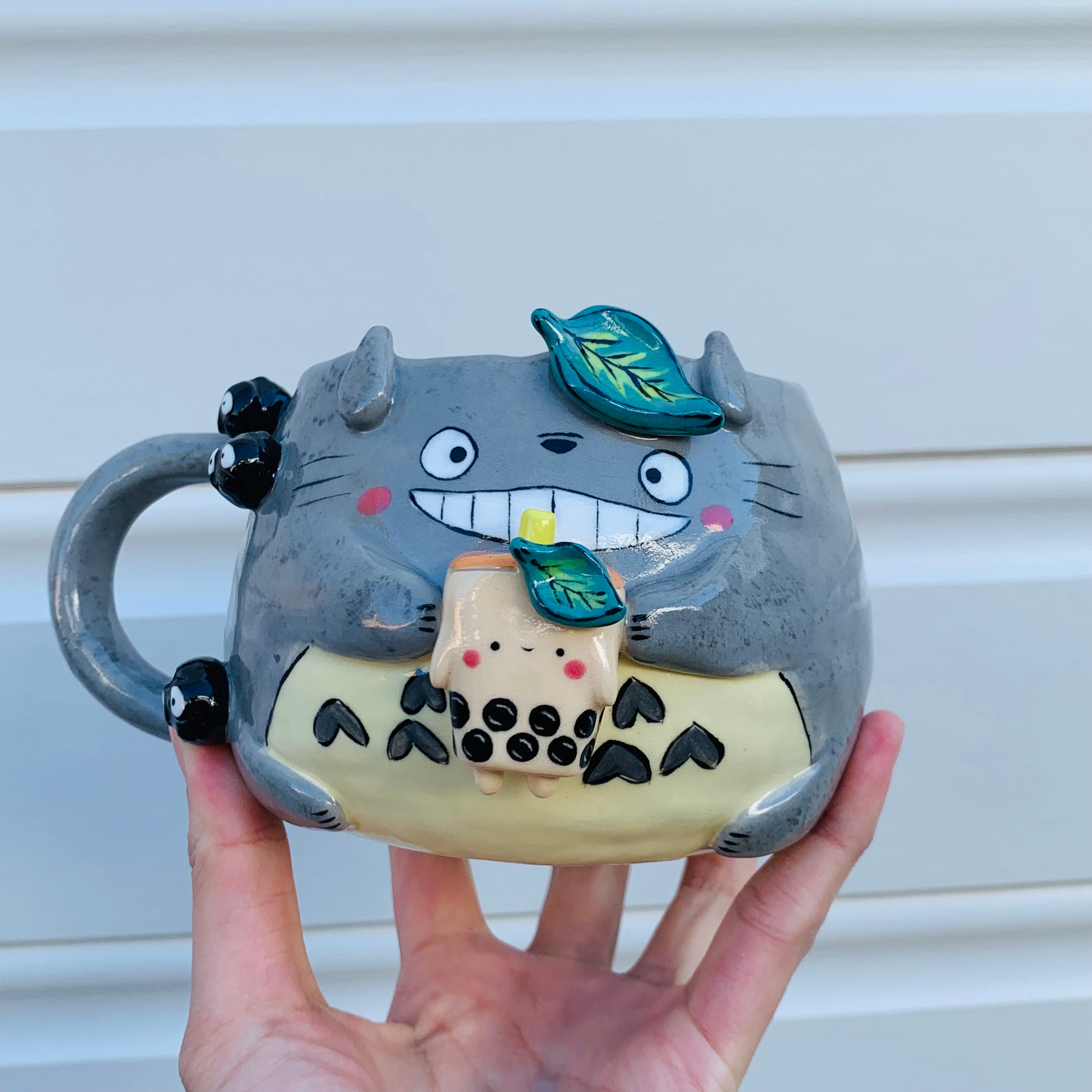 Smiling Totoro with bubble tea mug