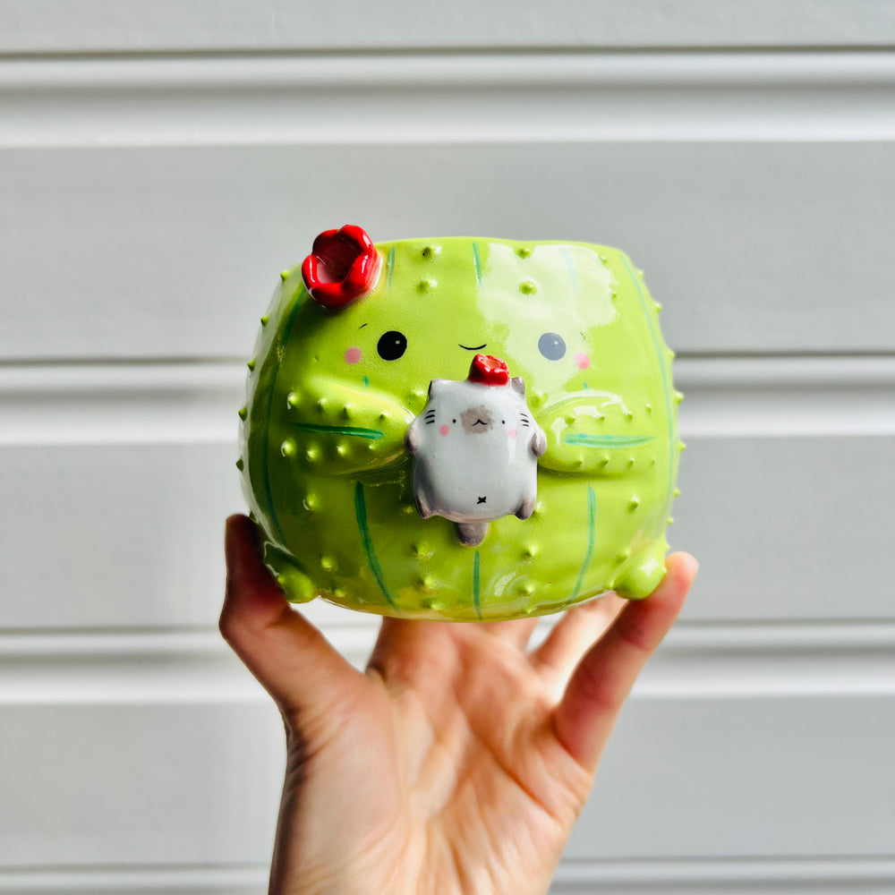 Flowery cactus pot with grey cat friend, photo 1 of 5