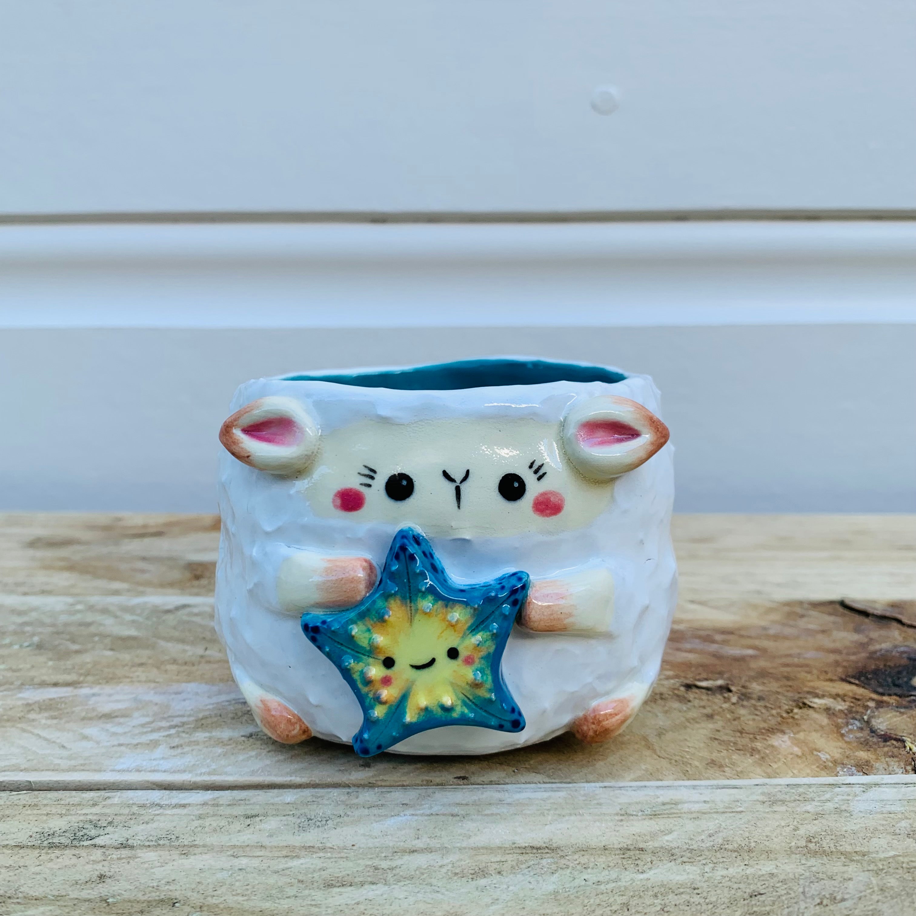 Small lamb planter with starfish friend planter