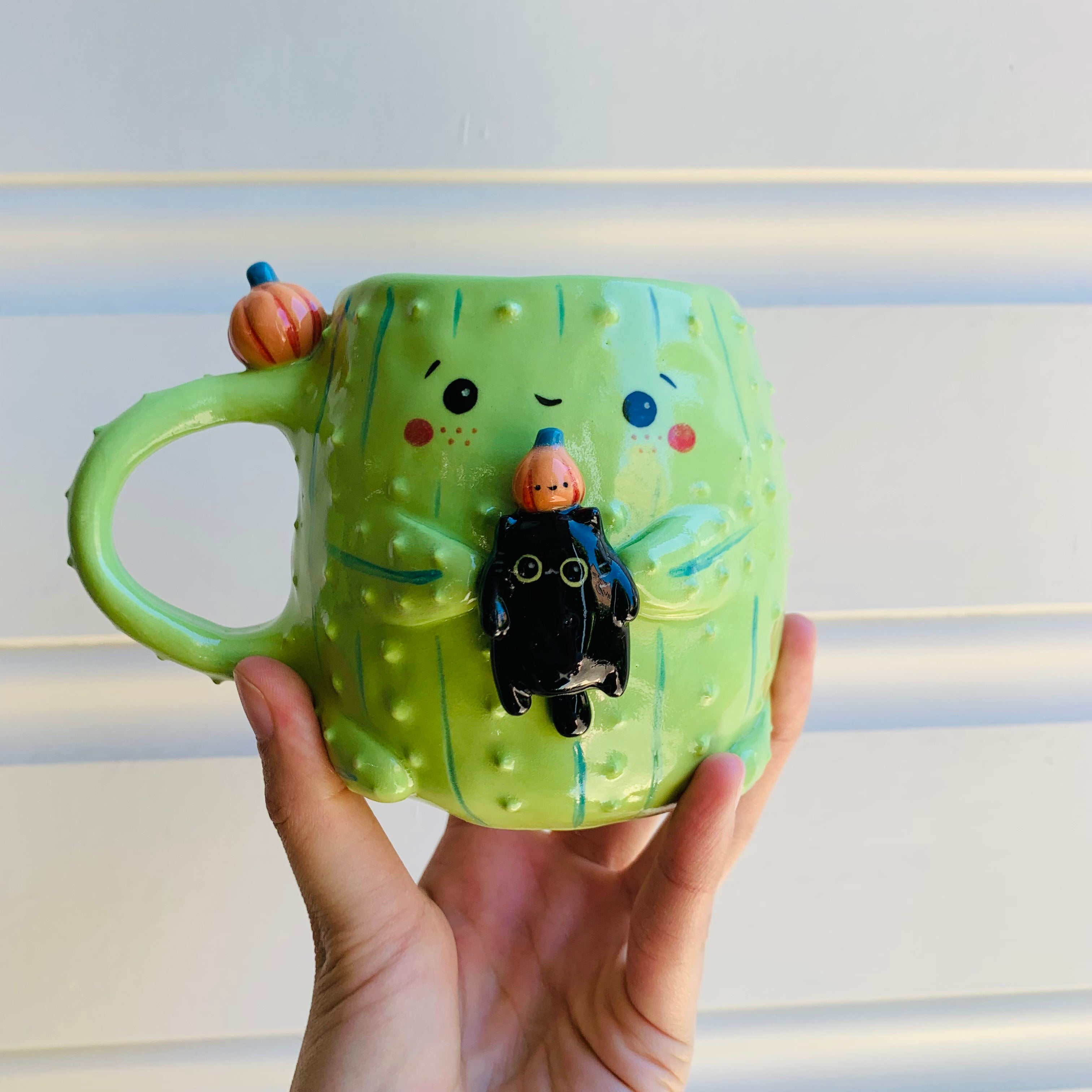 Pumpkin cactus mug with black cat friend