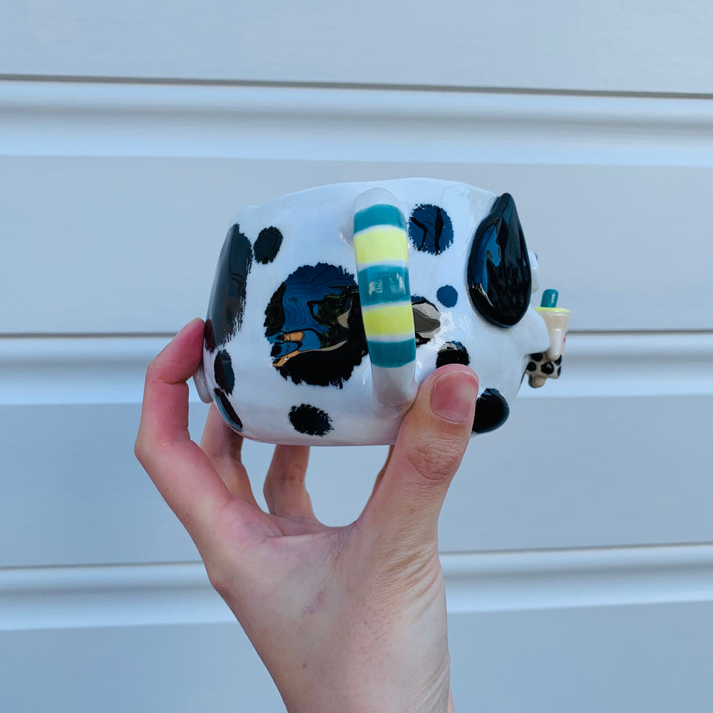 Black and white spotty doggo with bubble tea mug, photo 7 of 10