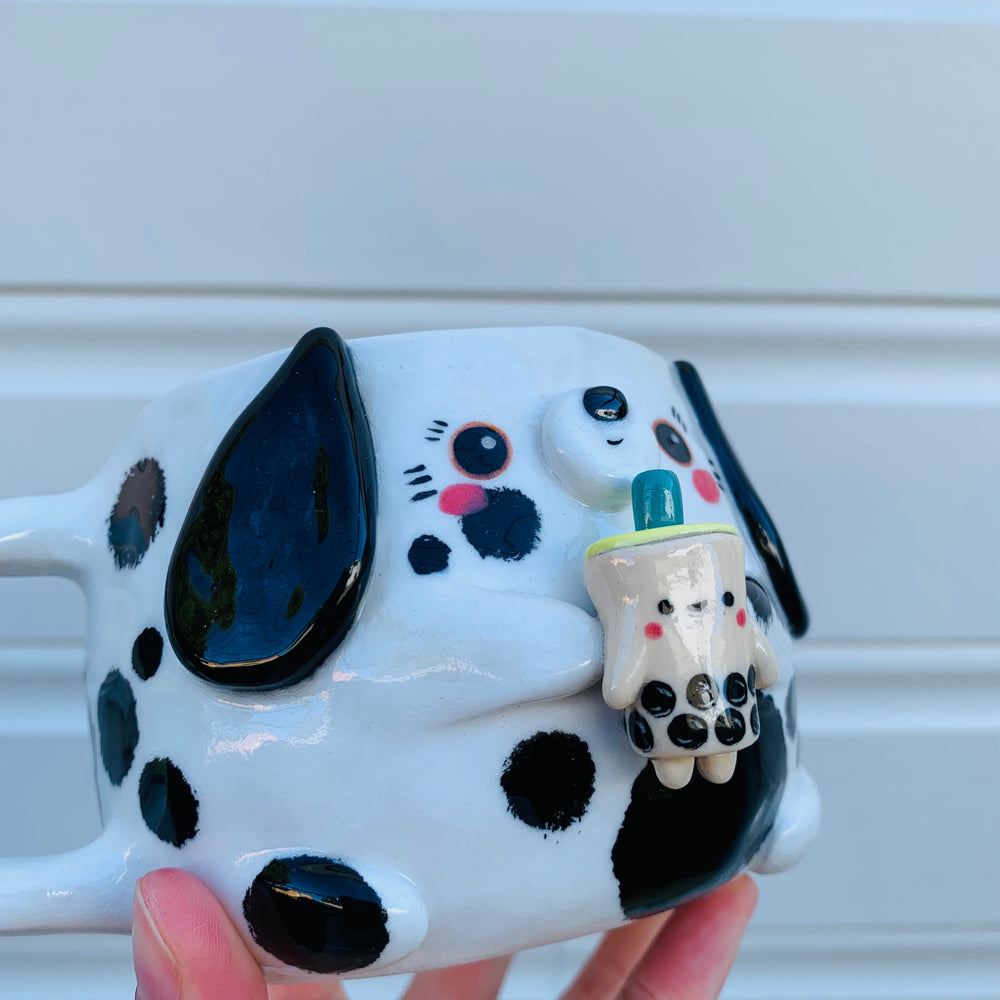 Black and white spotty doggo with bubble tea mug, photo 4 of 10