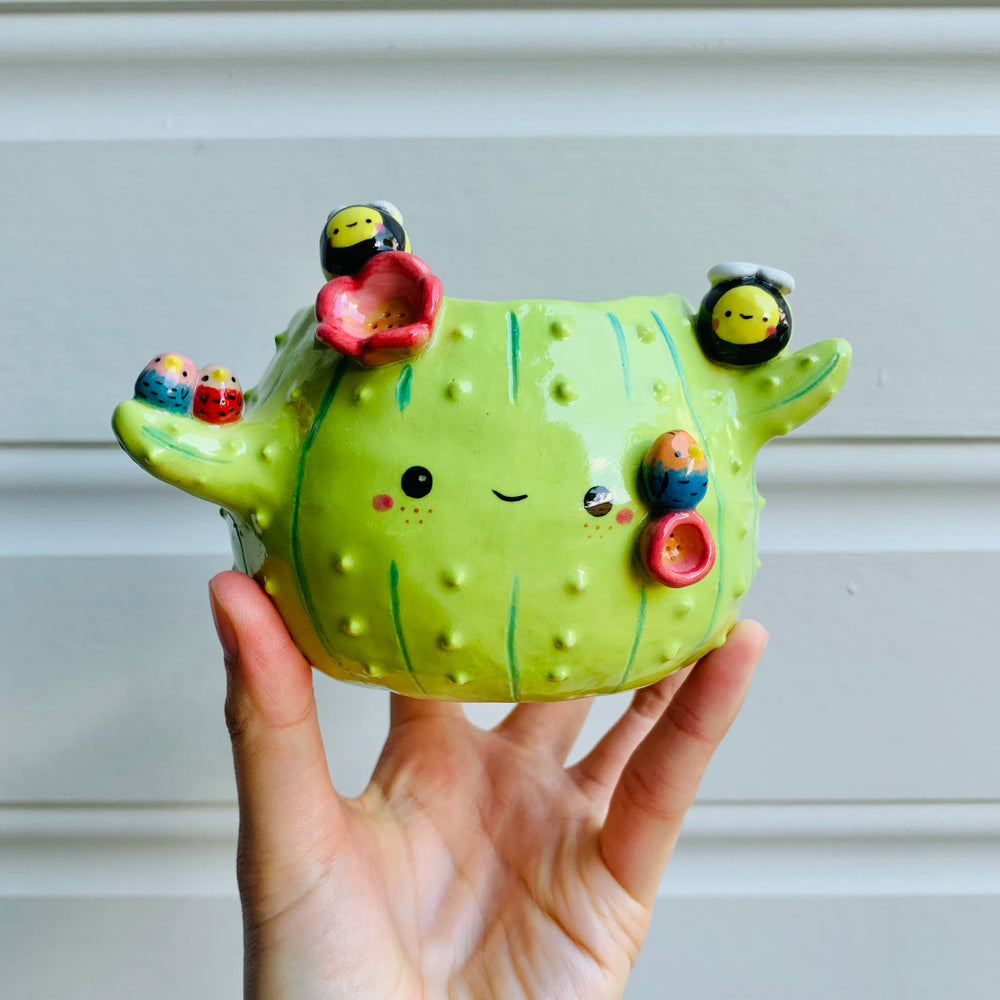 Flowery cactus pot with bird and bee friends, photo 1 of 8