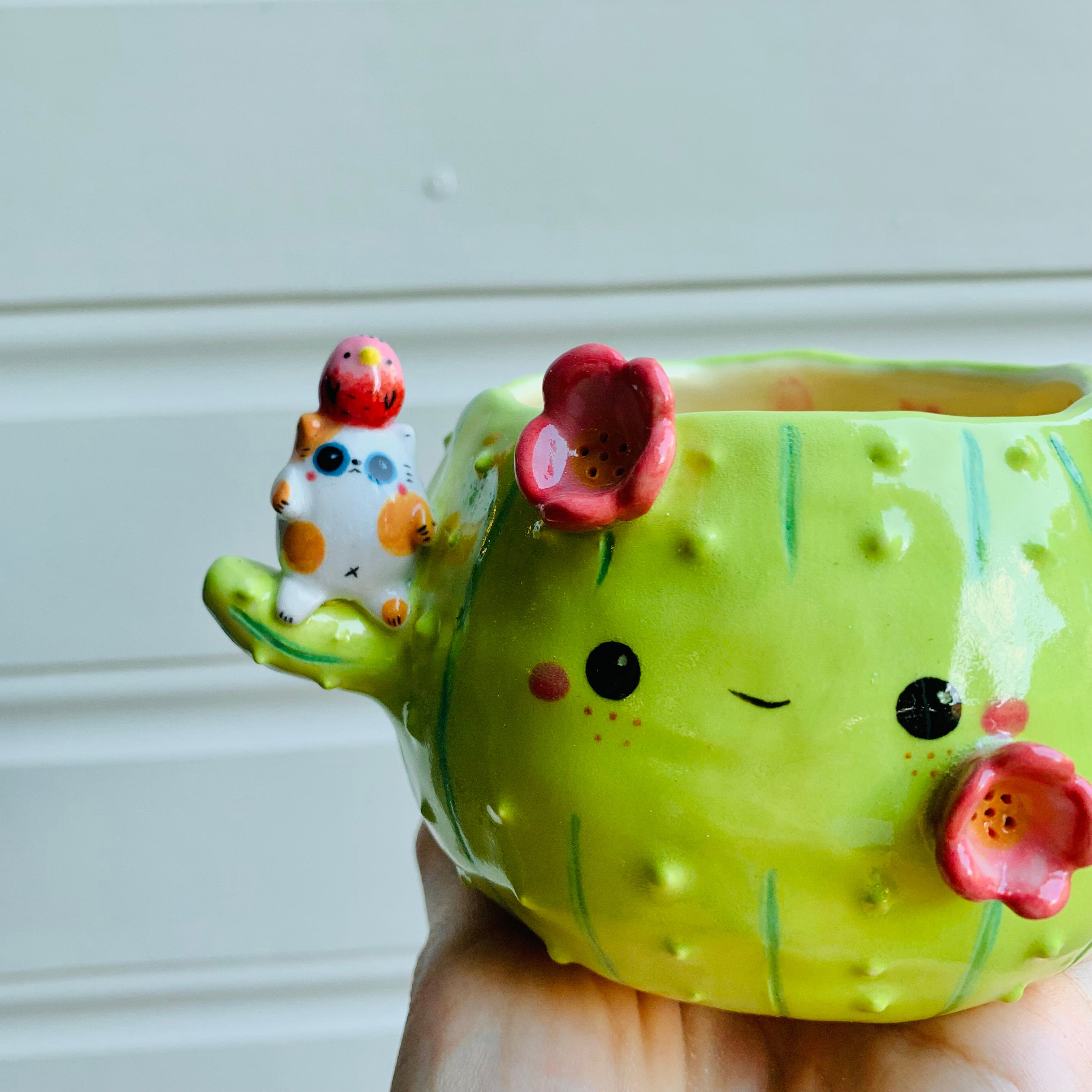 Flowery cactus pot with cat and bird friends